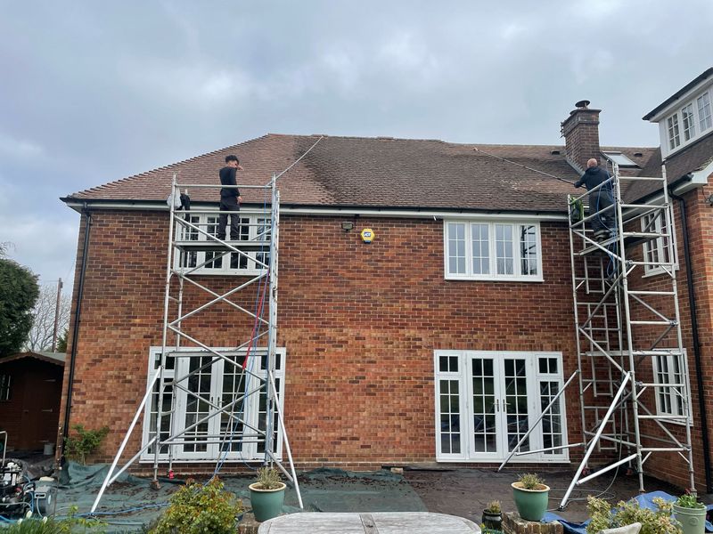 Roof cleaning carried out safely from scaffold towers by The Roof Moss Cleaners in Blackwater